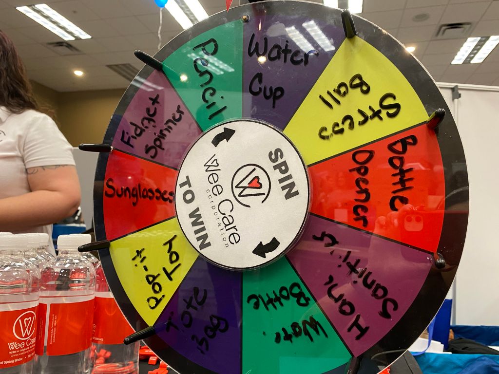 Various autism vendors had stations containing autism service brochures as well as fun spinning wheel games for people to earn prizes!